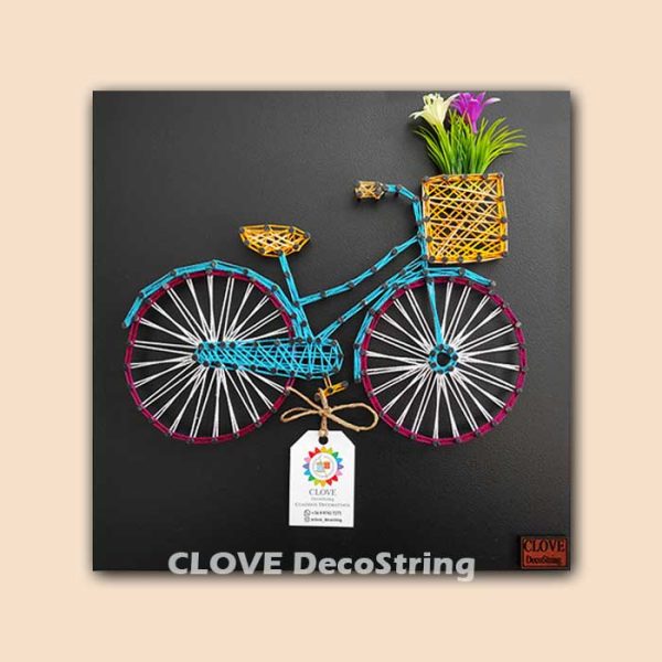 Bicicleta turquesa fondo negro 30x30